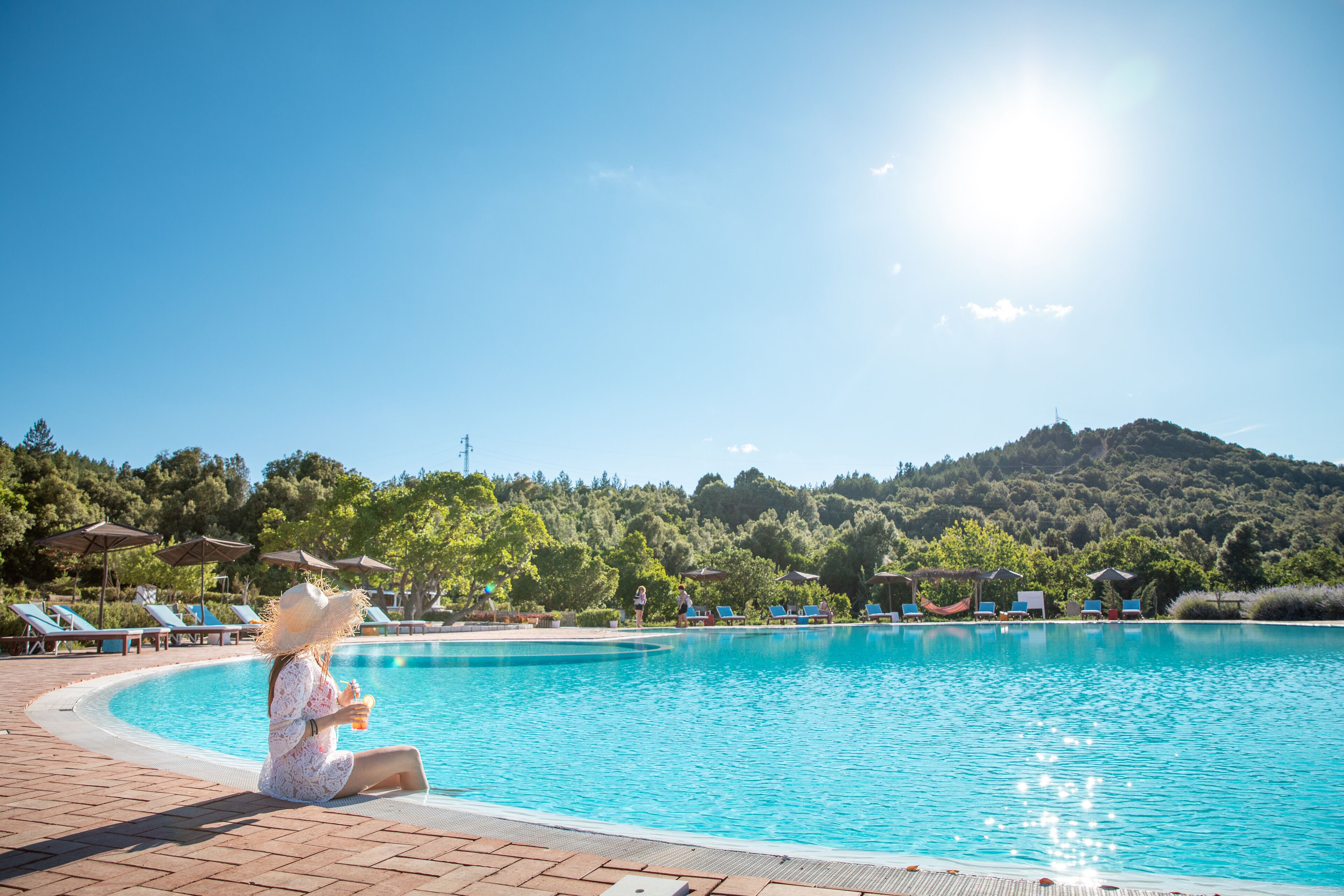 outdoor pool, pool umbrellas, pool loungers