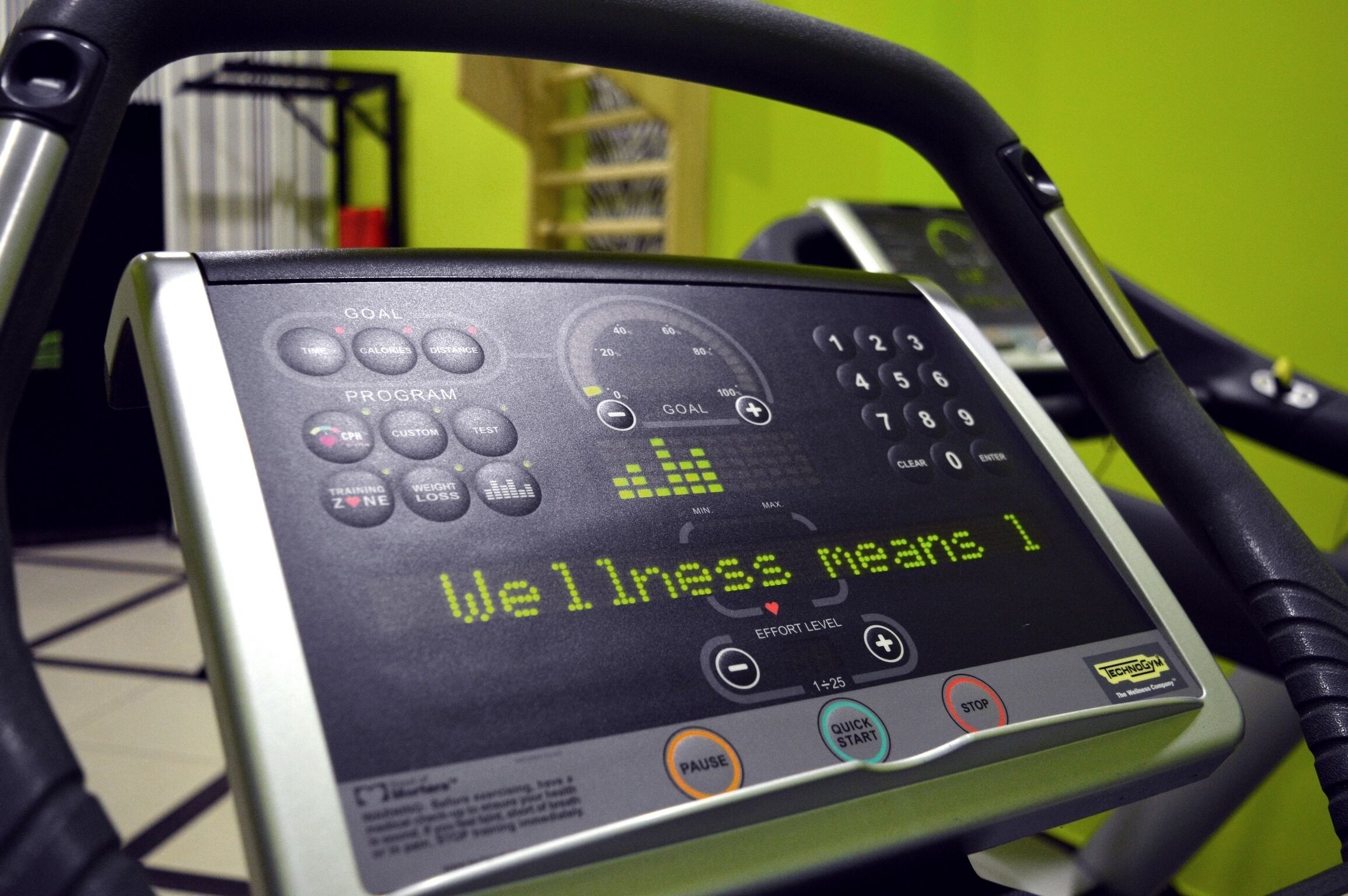 A fitness machine with a digital display and control panel.
