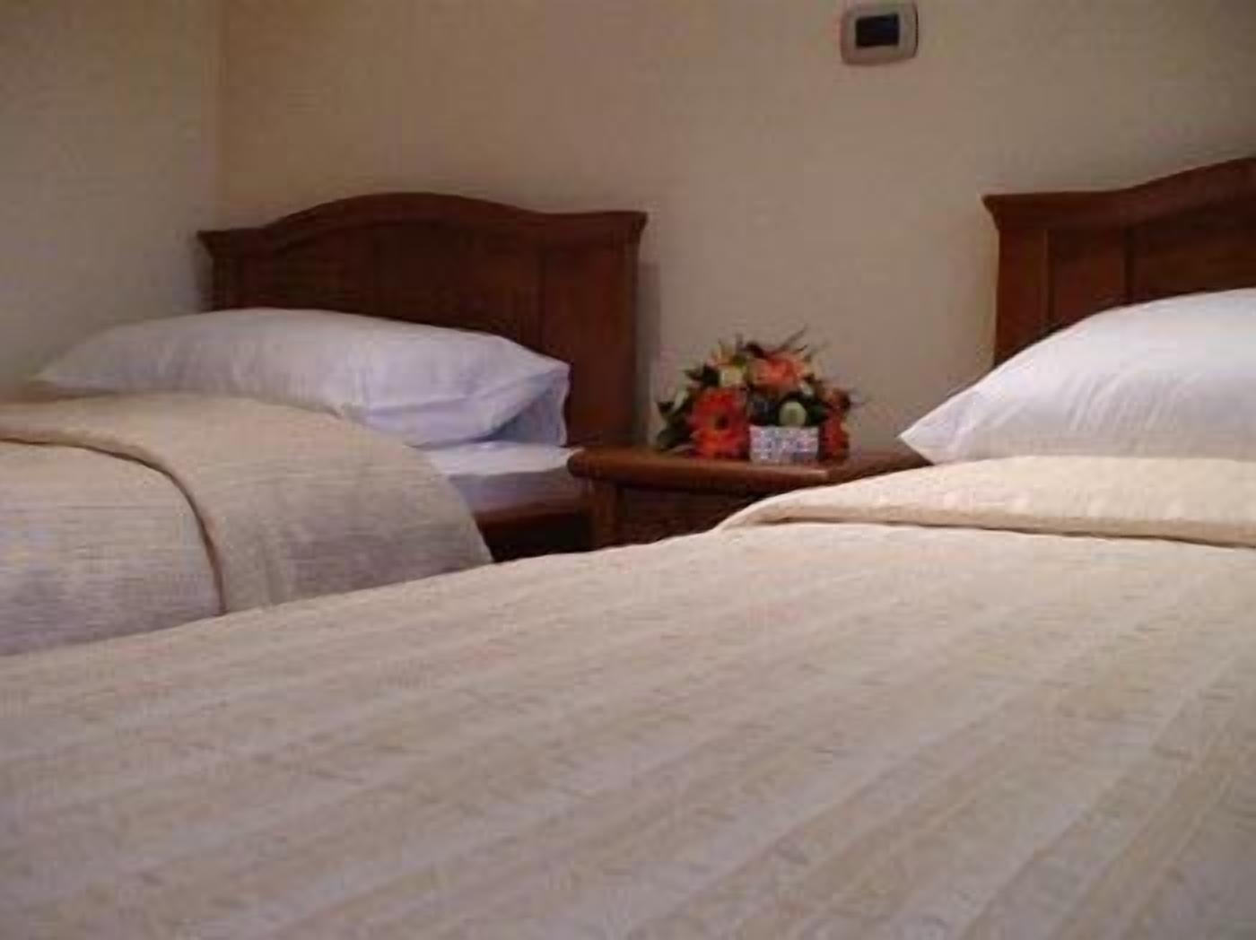 double room, multiple beds | premium bedding, minibar, in-room safe, desk