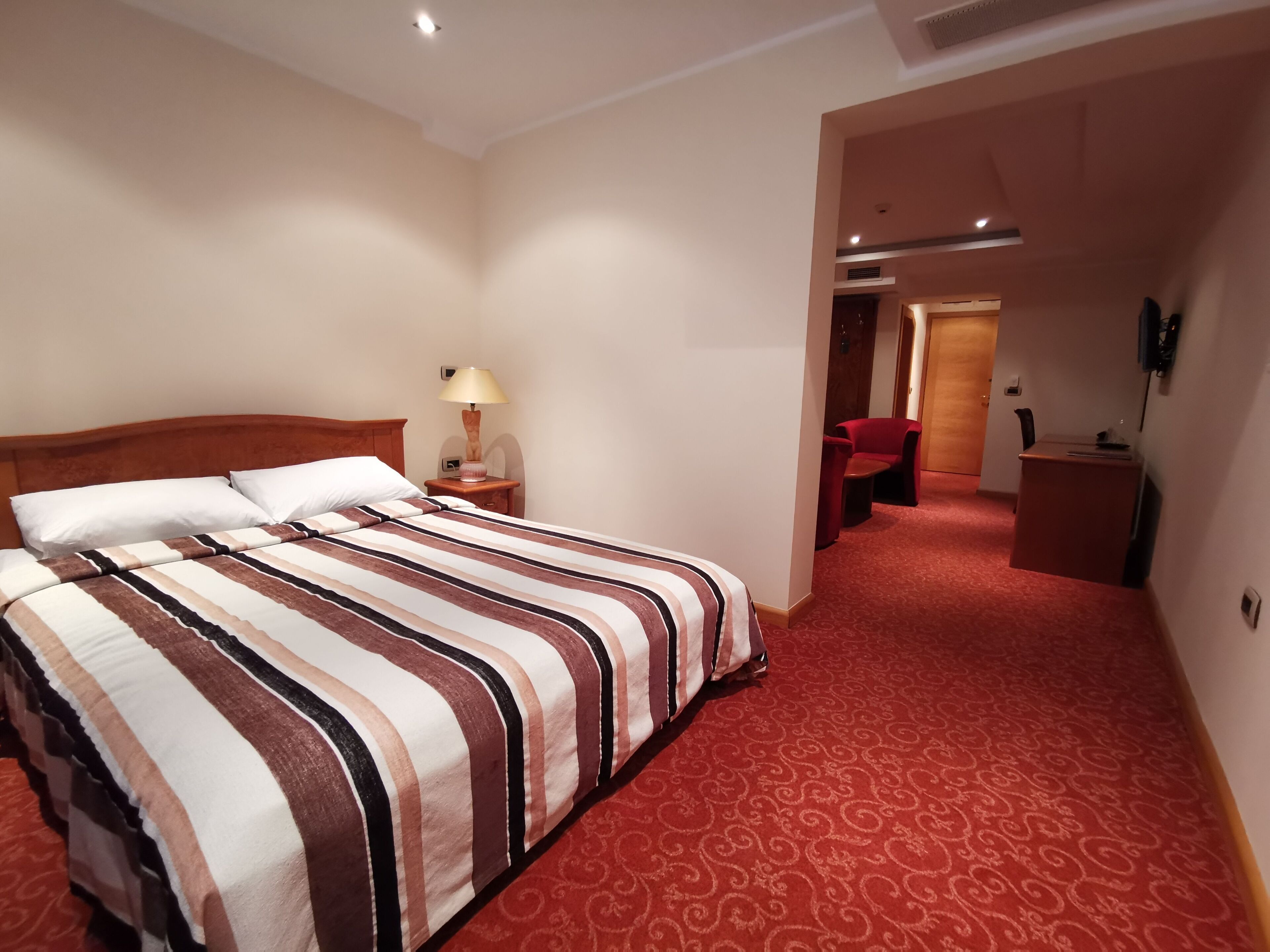 deluxe triple room | premium bedding, minibar, in-room safe, desk