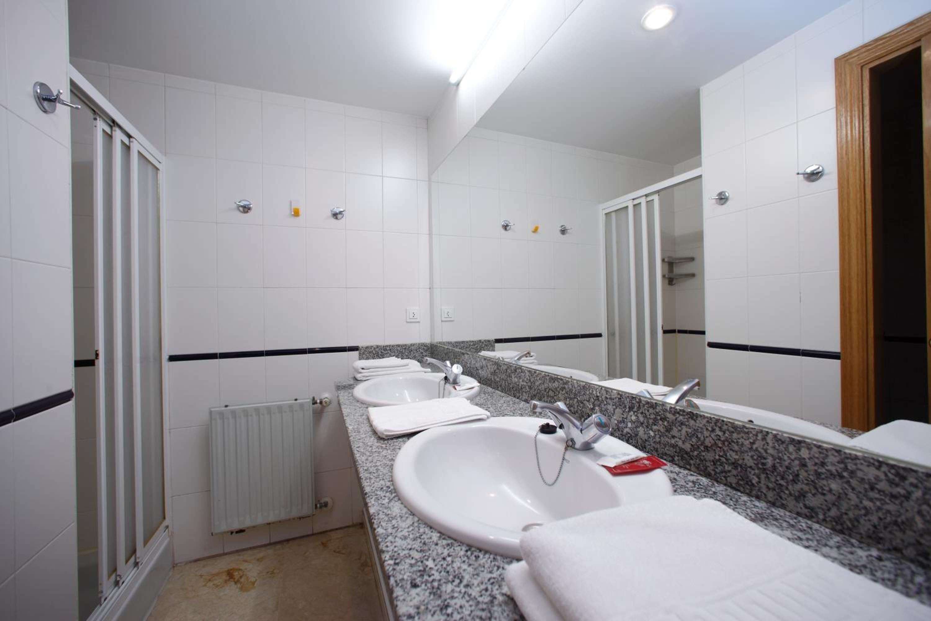 shower, towels, soap, toilet paper