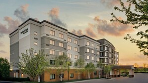 A Courtyard by Marriott hotel with a modern design, multiple floors, and a covered entrance. - Courtyard Pittsburgh Airport Settlers Ridge (Pittsburgh)