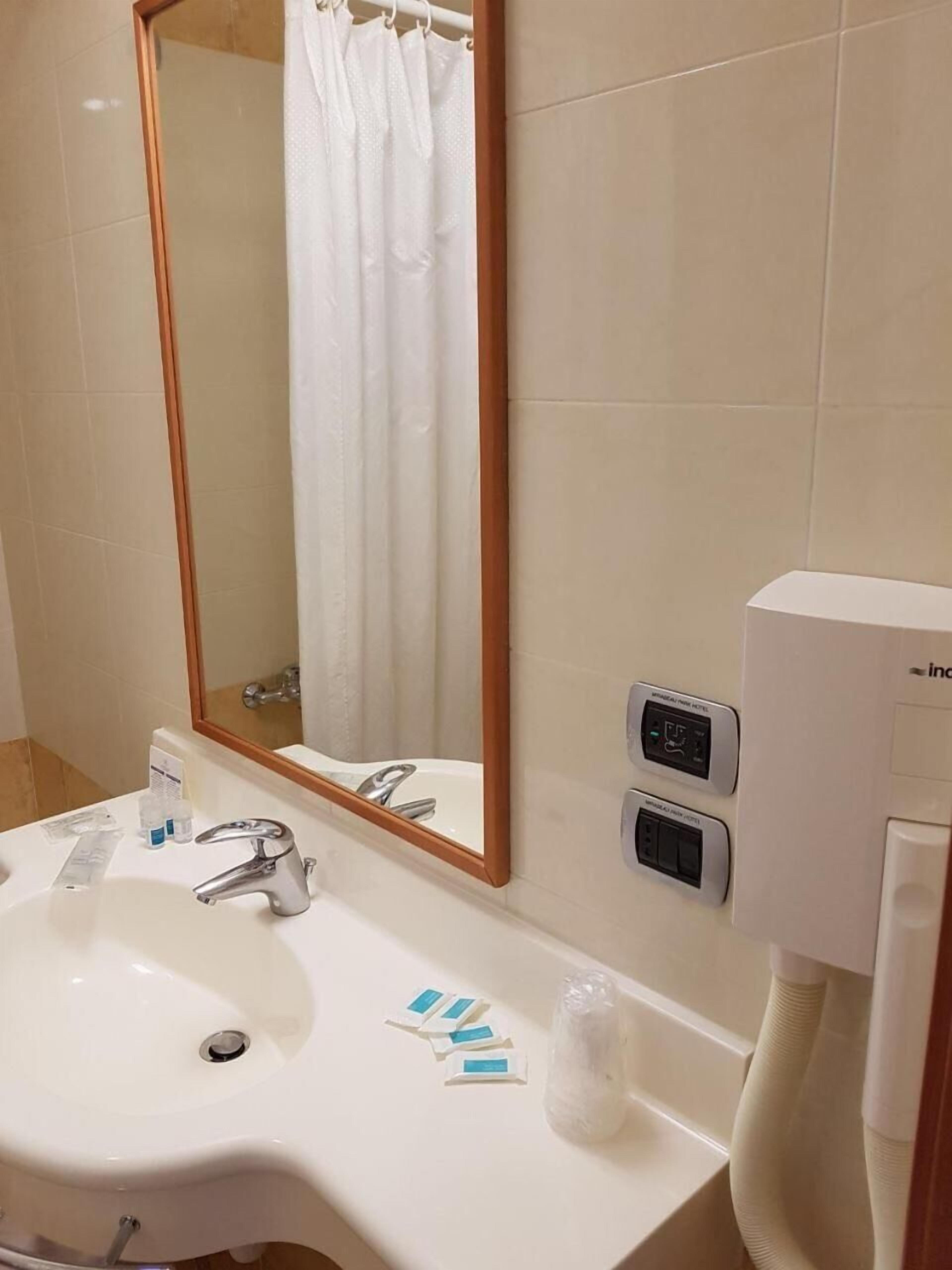 bathtub, free toiletries, hair dryer, slippers