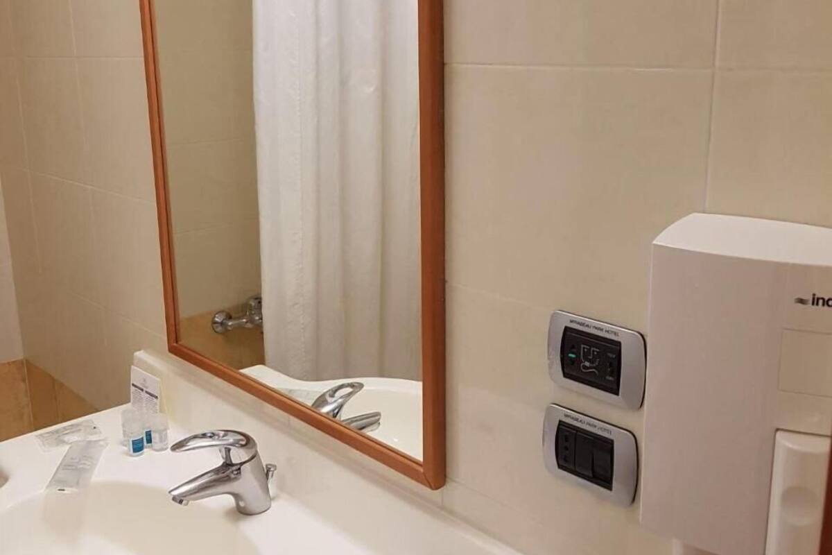 bathtub, free toiletries, hair dryer, slippers