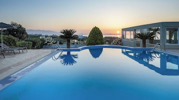 Outdoor pool, open 9:00 AM to 8:00 PM, pool umbrellas, sun loungers