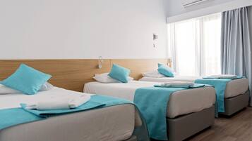Standard Triple Room | Pillow-top beds, in-room safe, iron/ironing board, free cots/infant beds
