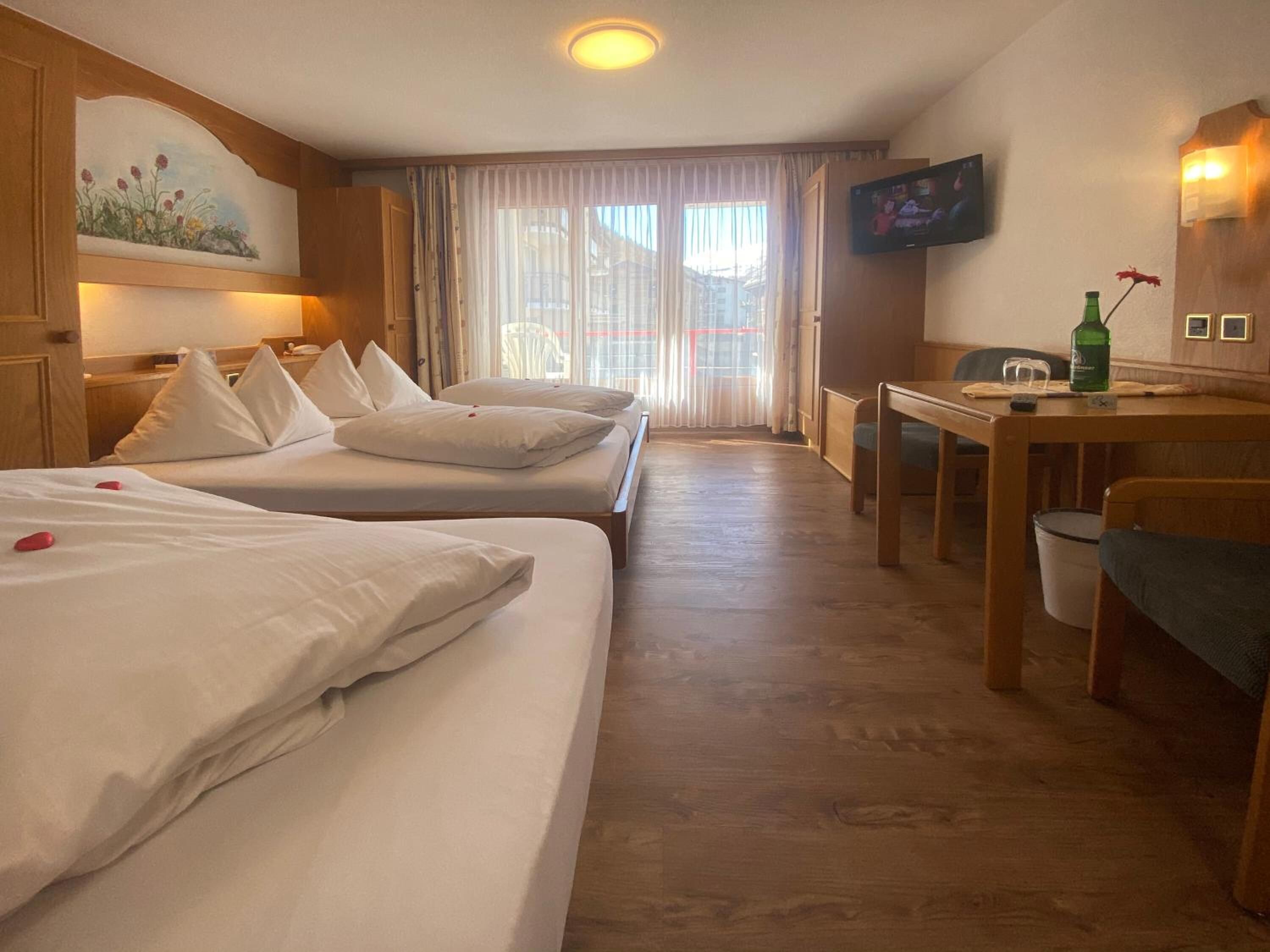 standard triple room, balcony, mountain view | hypo-allergenic bedding, in-room safe, blackout curtains, soundproofing