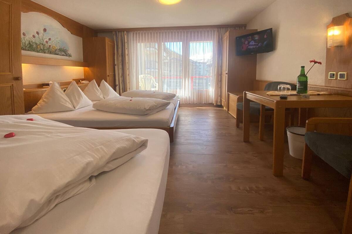 standard triple room, balcony, mountain view | hypo-allergenic bedding, in-room safe, blackout curtains, soundproofing