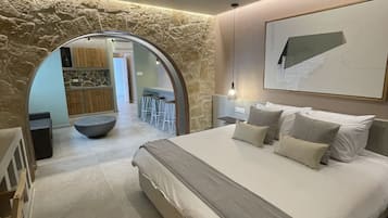 Suite Deluxe | Coffres-forts dans les chambres, rideaux occultants