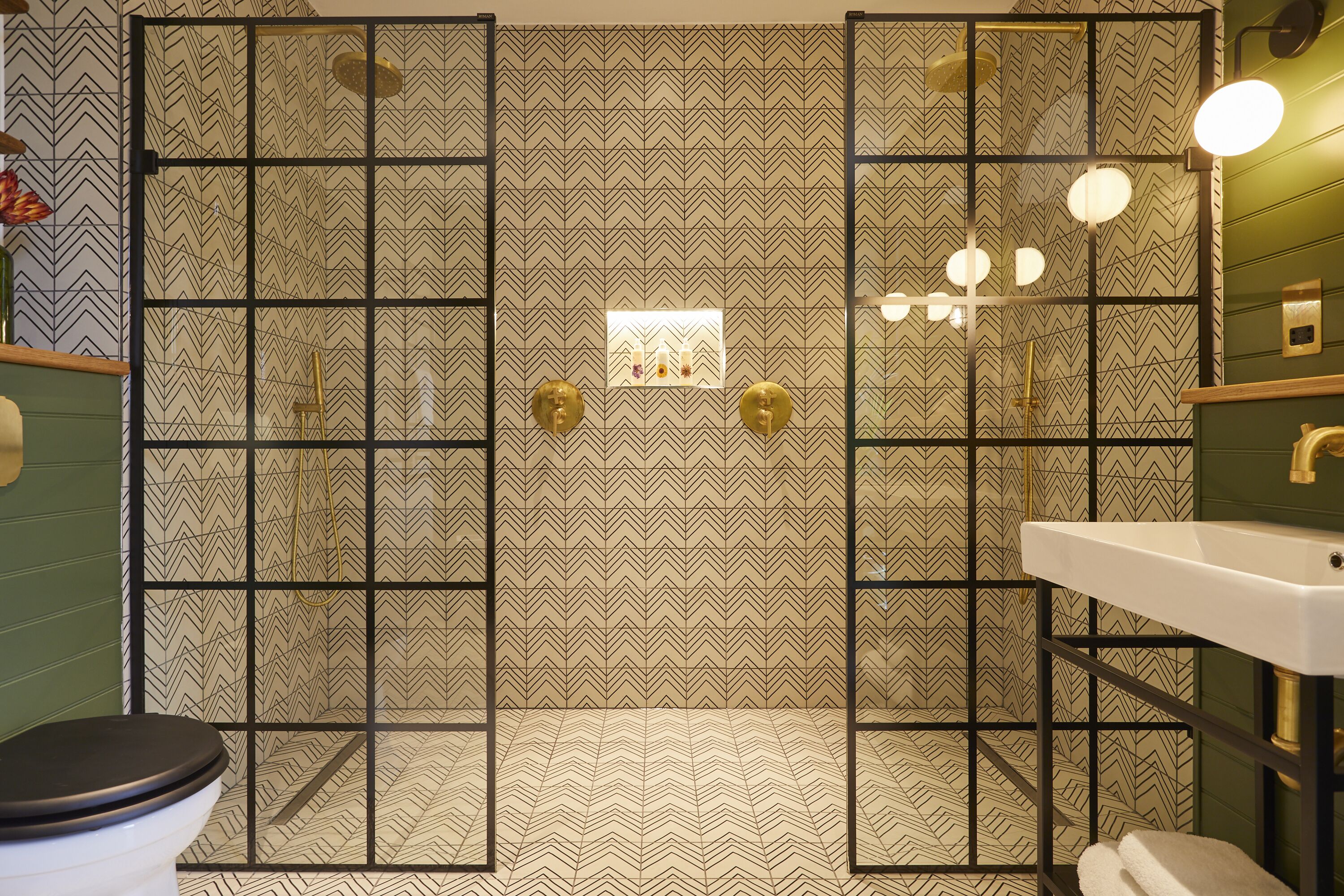 separate bathtub and shower, rainfall showerhead, designer toiletries