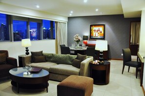 Two bedroom deluxe | Living area | LED TV, DVD player, books