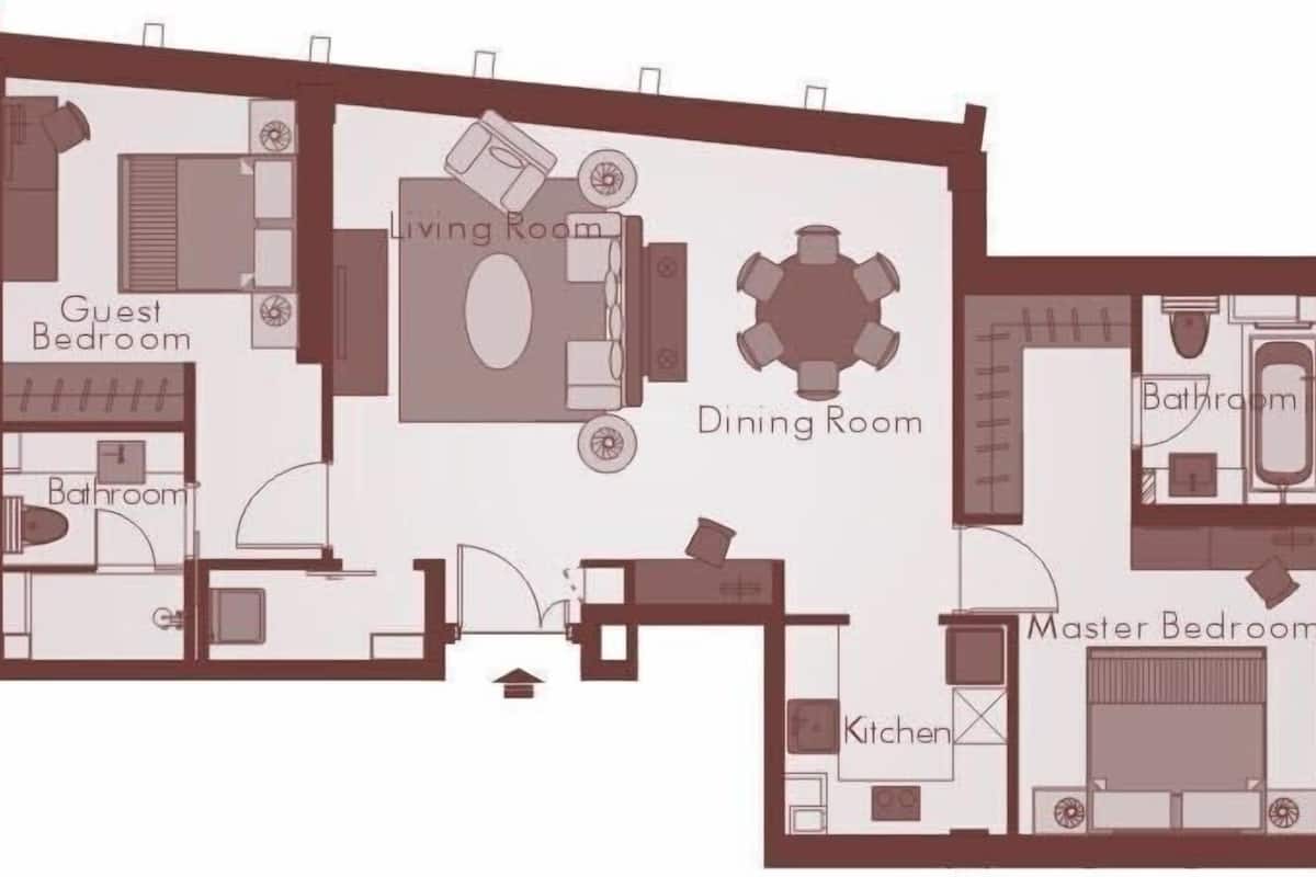 A floor plan of a hotel with a guest bedroom, master bedroom, dining room, kitchen, and bathroom.