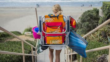 On the beach, sun-loungers, beach umbrellas, beach towels