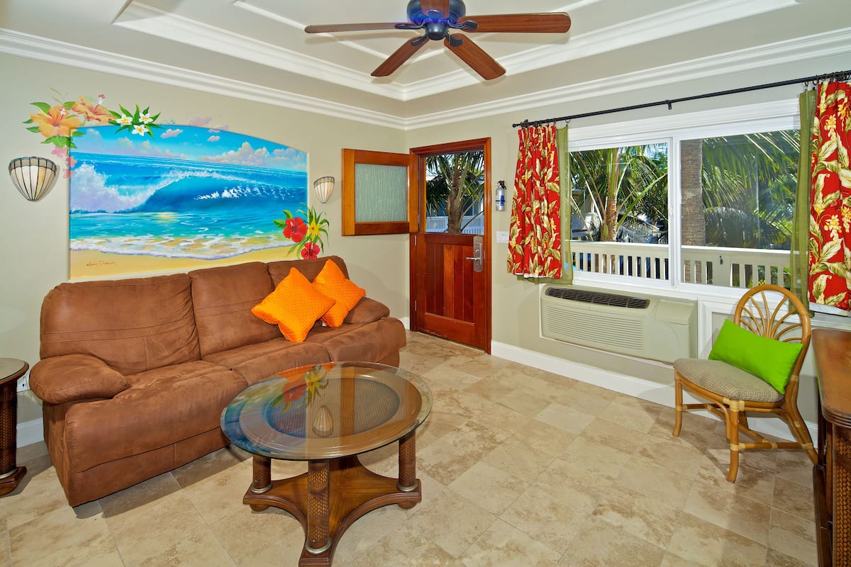 Luxury Suite, 2 Bedrooms | Living area | LED TV, iPod dock