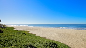 On the beach, sun-loungers, beach umbrellas, beach towels