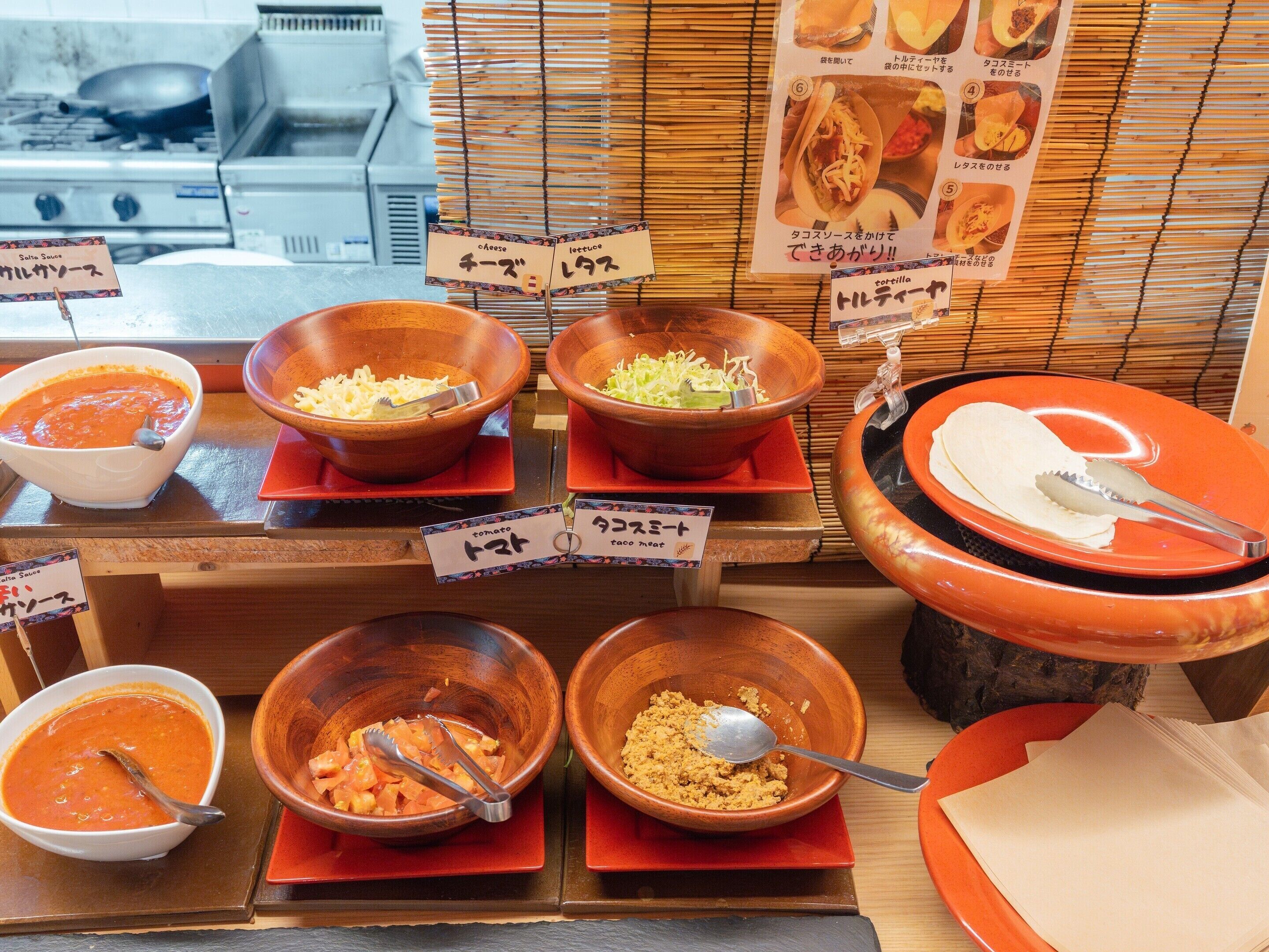 A food display with various dishes and condiments.