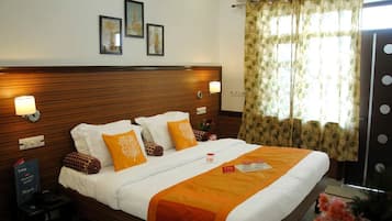 Premium bedding, down comforters, pillowtop beds, in-room safe