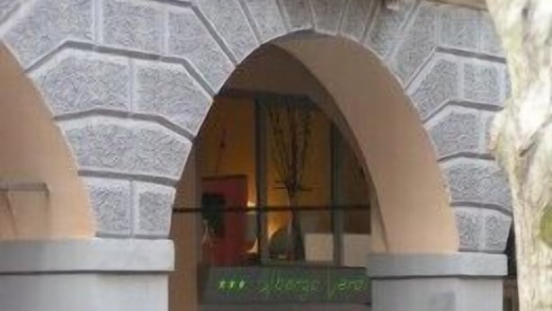 A building entrance with stone arches and a sign that reads "Hotel". - Albergo Verdi (Padova)