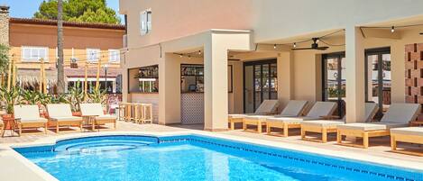 Outdoor pool, open 10:00 AM to 6:00 PM, pool umbrellas, pool loungers