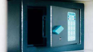 A black security keypad with a blue arrow button and a label reading "Electrolux."