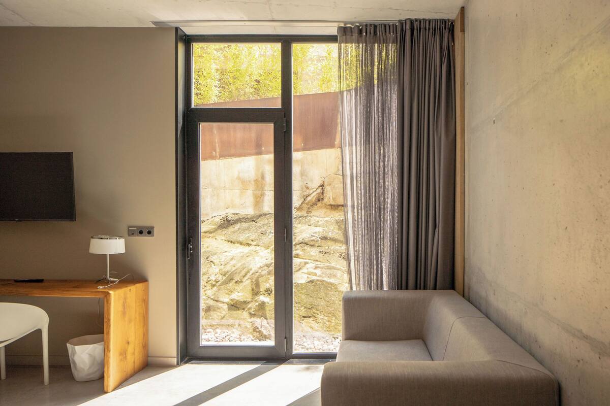 deluxe double room, terrace | living area | flat-screen tv, dvd player, heated floors