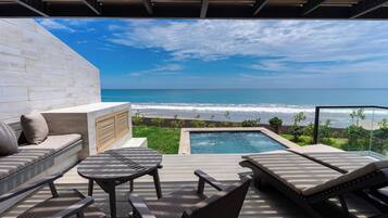 Beachfront Suite with Dip Pool | Living area | 32-inch LED TV with cable channels, TV