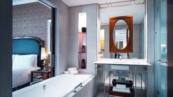 Separate tub and shower, deep soaking tub, designer toiletries