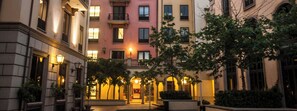Stroll through a serene urban oasis surrounded by classic buildings with beautifully maintained greenery.
