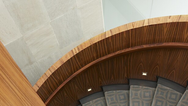 A spiral staircase with wooden steps and patterned cushions. - Las Alcobas, a Luxury Collection Hotel, Mexico City (Mexico City)