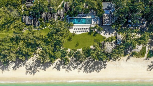 An aerial view of a resort with a large pool, beachfront, and lush greenery. - Renaissance Phuket Resort & Spa (Mai Khao)