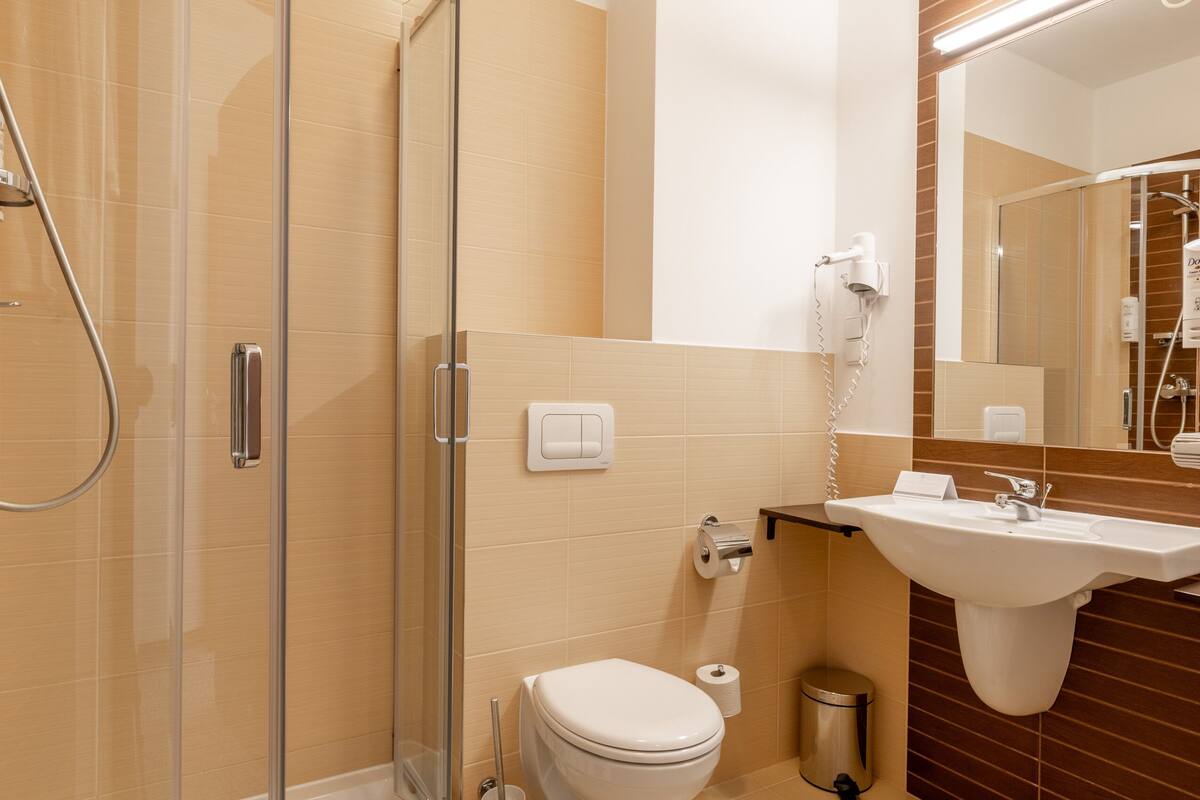 shower, hair dryer, bathrobes, slippers