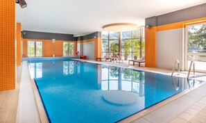Indoor pool, open 9:00 AM to 9:00 PM, pool loungers