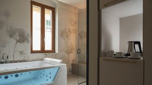 A modern bathroom with a freestanding bathtub, a glass shower enclosure, and a coffee station. - Hotel Parma e Oriente Wellness & Spa (Montecatini Terme)