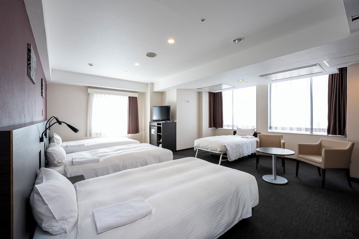 Quadruple Room, Non Smoking | Premium bedding, down comforters, desk, blackout drapes