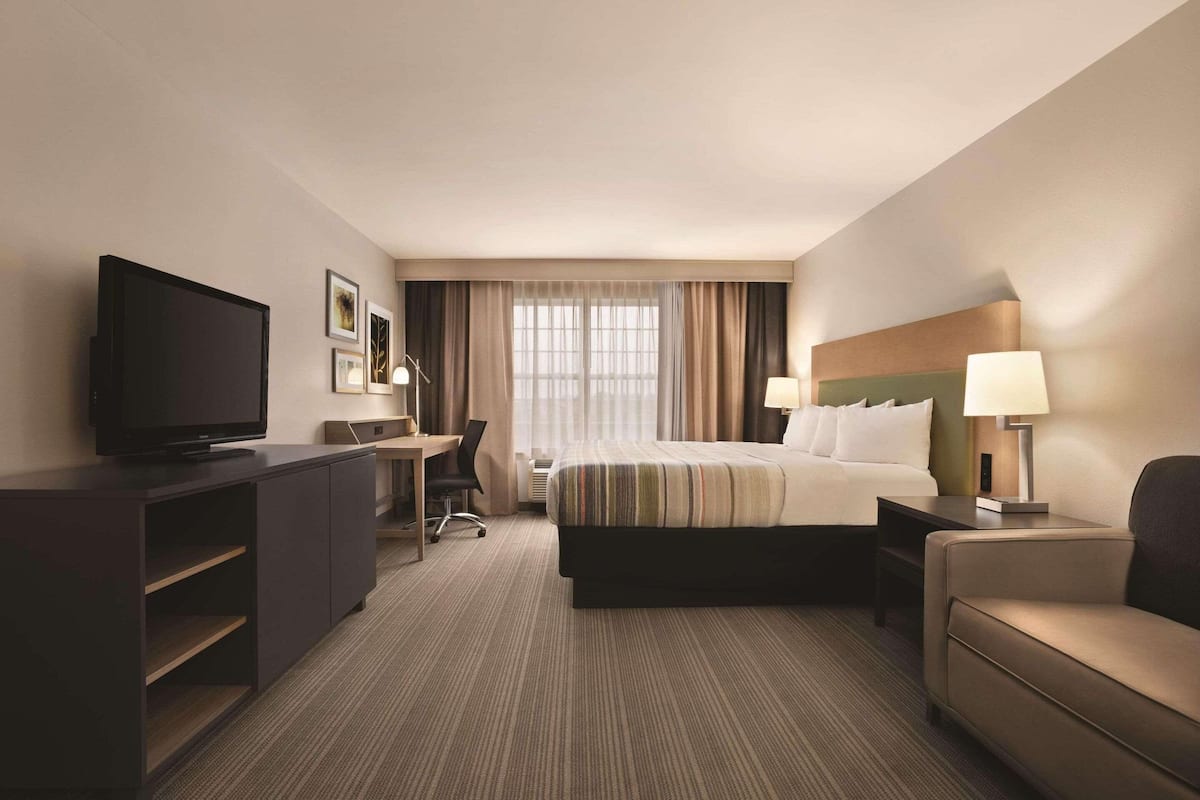 Studio Suite, 1 King Bed, Non Smoking | 1 bedroom, down comforters, individually decorated