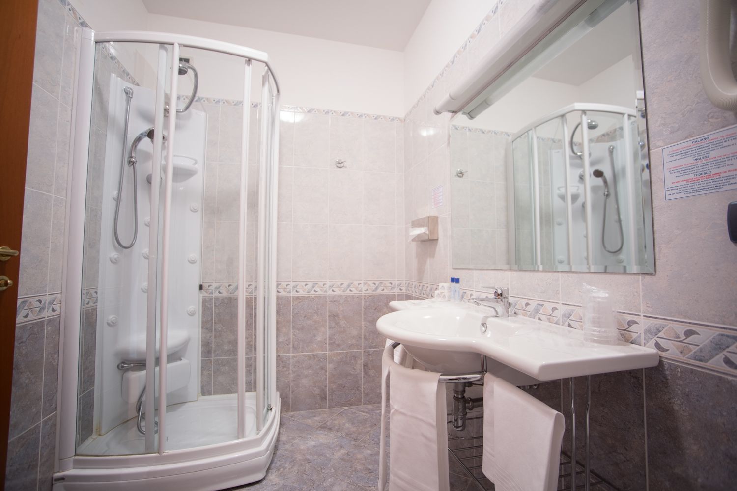 hair dryer, slippers, bidet, towels