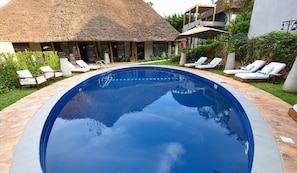 Outdoor pool, pool umbrellas, pool loungers