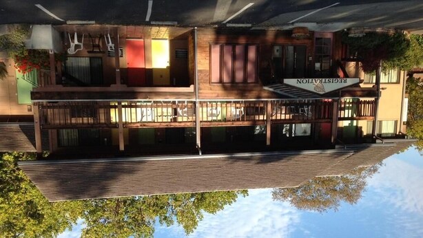 A two-story building with a sign reading "RECREATION". - Humboldt Redwoods Inn (Garberville)