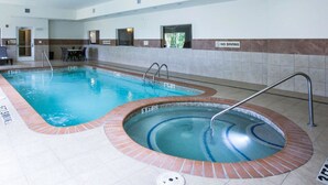 An indoor swimming pool with a hot tub, a dining area, and a 'No Diving' sign. - Sleep Inn & Suites Round Rock - Austin North (Round Rock)
