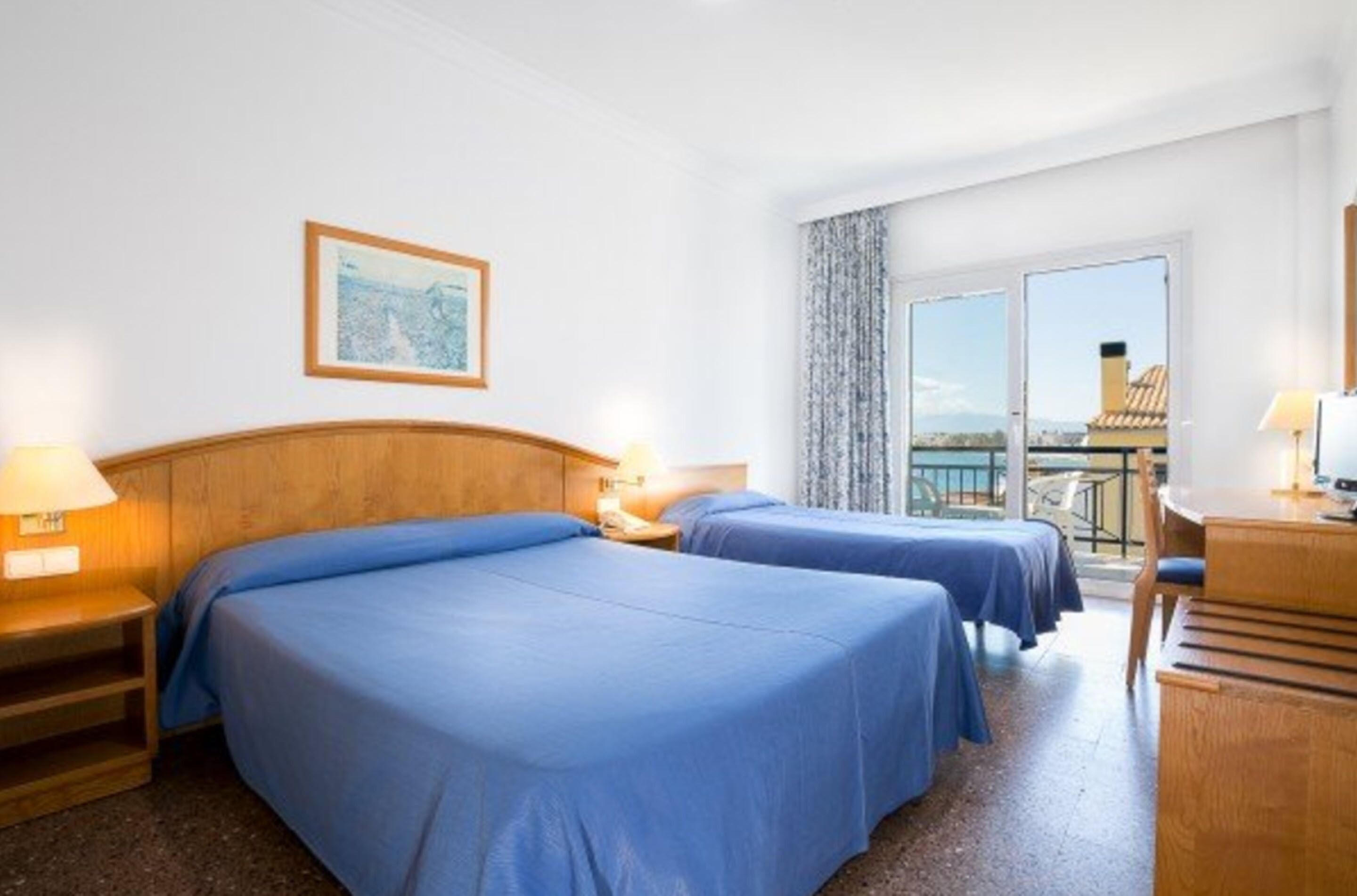 triple room, partial sea view | in-room safe, desk, free cots/infant beds, rollaway beds