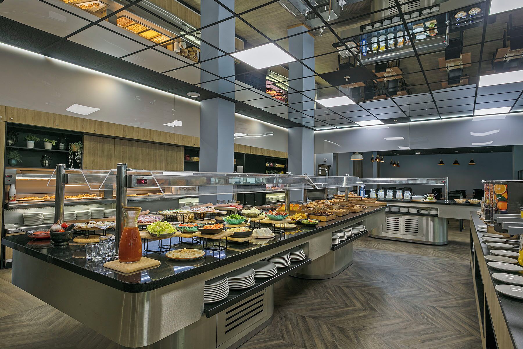 A buffet with various food items and a self-service station.