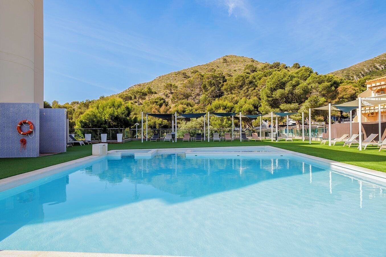 Seasonal outdoor pool, open 10:00 AM to 10:00 PM, pool umbrellas