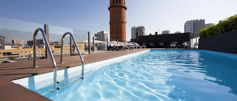 Seasonal outdoor pool, pool loungers