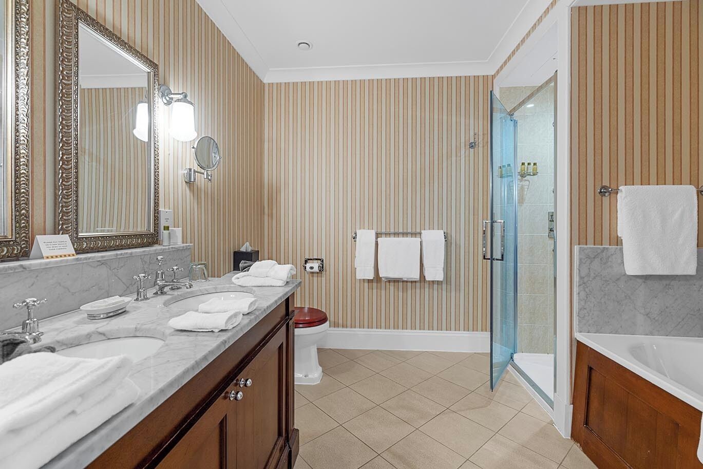 classic king room | bathroom | rainfall showerhead, free toiletries, hair dryer, bathrobes