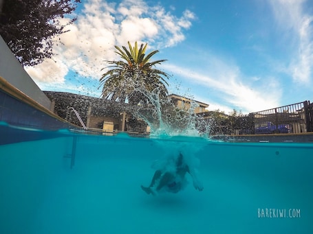 Seasonal outdoor pool, a heated pool, sun loungers