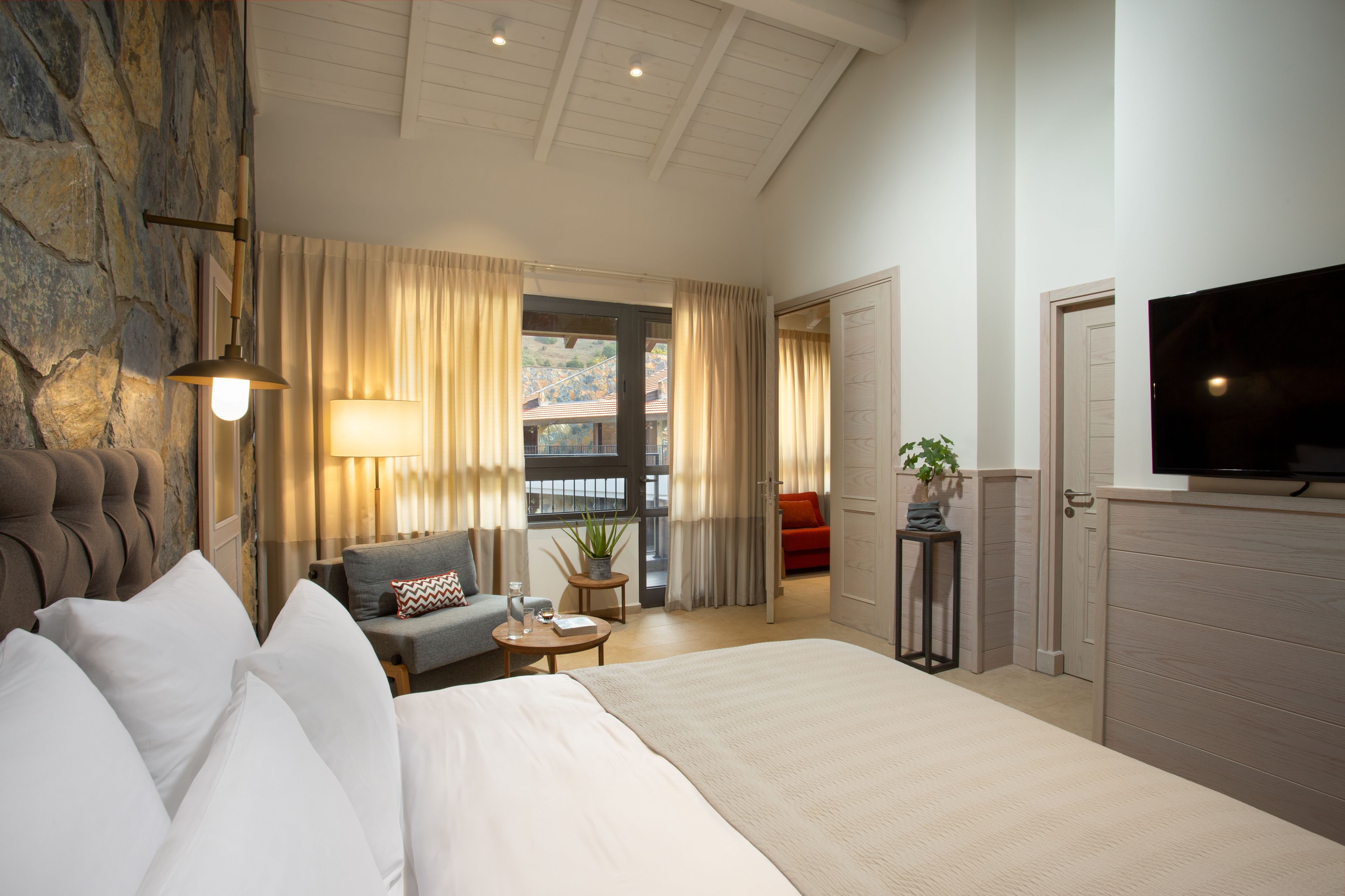 Deluxe Suite, Balcony, Mountain View | Living area | TV