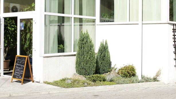 A hotel named 'Hotel Pacific' with a modern design, large windows, and a signboard outside. - Hotel Pacific Timisoara (Timisoara)