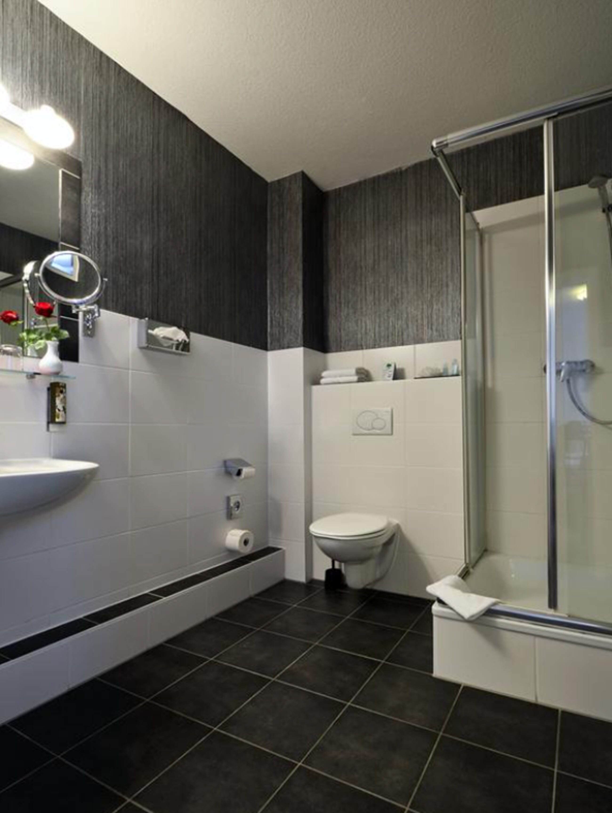 shower, hair dryer, slippers, towels