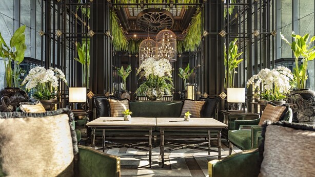 A luxurious lobby with a central seating area, surrounded by tall plants and decorative lighting. - Kempinski Hotel Yinchuan (Yinchuan)