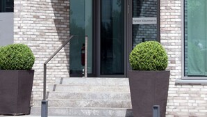 A building with a sign reading "PIER 16" above the entrance. - Atlantic Hotel Kiel (Kiel)